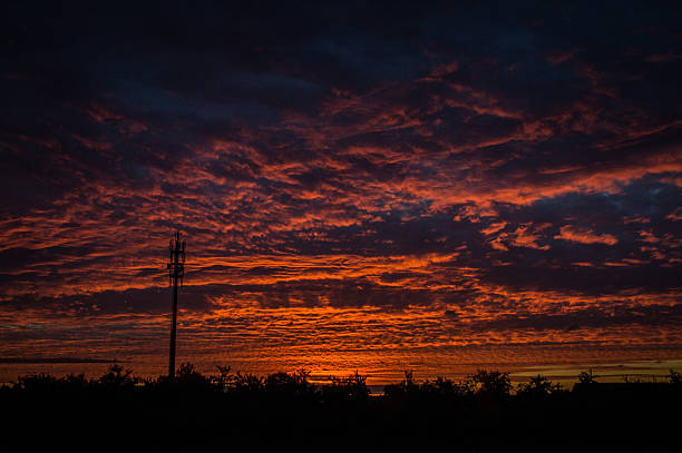 istock Rheinland Germany beautiful sunset landscape with cell phone tower 488077939