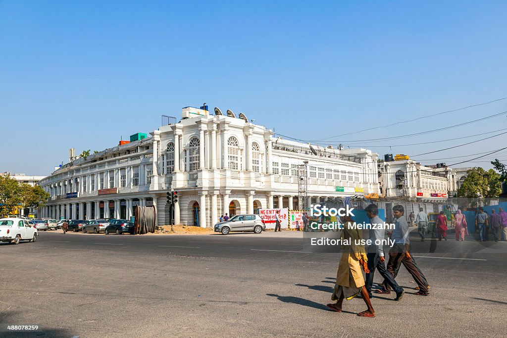 people at the Connaught place in Delhi New Delhi, India - October 16, 2012: people at the Connaught place in Delhi. Connaught Place is one of the largest financial, commercial and business centers in Delhi, India. Named after the Duke of Connaught, the construction work was  completed in 1933. It is the fourth most expensive office destination in the world. Connaught Place Stock Photo