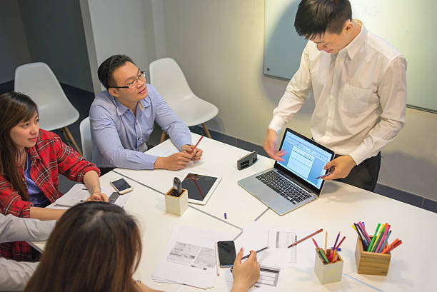 istock Businessman presenting the new working plan to his team 488079862