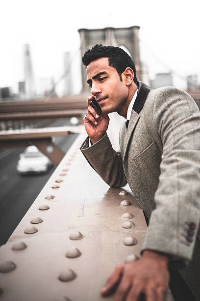 istock Businessman on the phone in brooklyn bridge 488080567