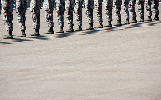 The legs of Air Force Airmen stading at attention.  These are honor graduates being recognized during the ceremony of graduation from Basic Military Training at Lackland Air Force Base at Joint Base San Antinio, Texas, Sept, 2015.