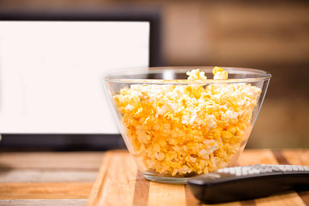 istock Watching show, movie on television at home. Popcorn, remote control. 488081542