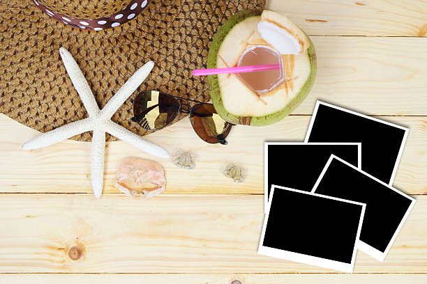 istock beach accessories on wooden board with poraloid 488081618