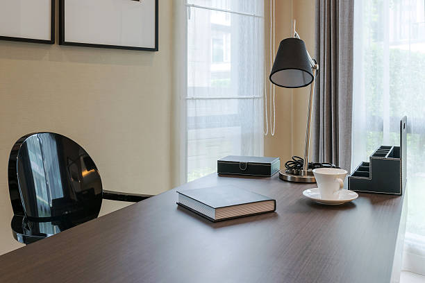 istock wooden table and books in modern working room interior 488083648