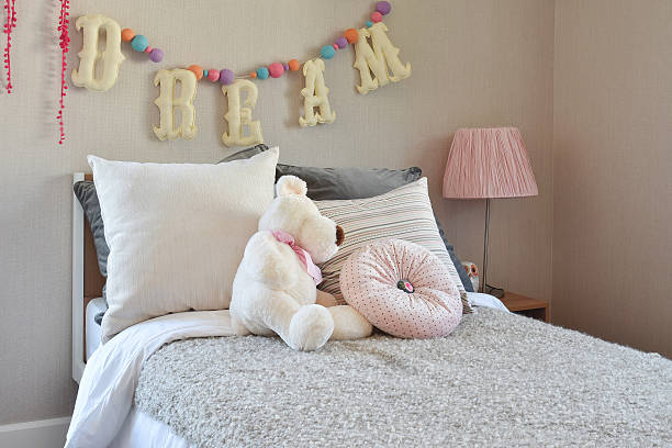 istock modern kids room with doll and pillows on bed 488084796