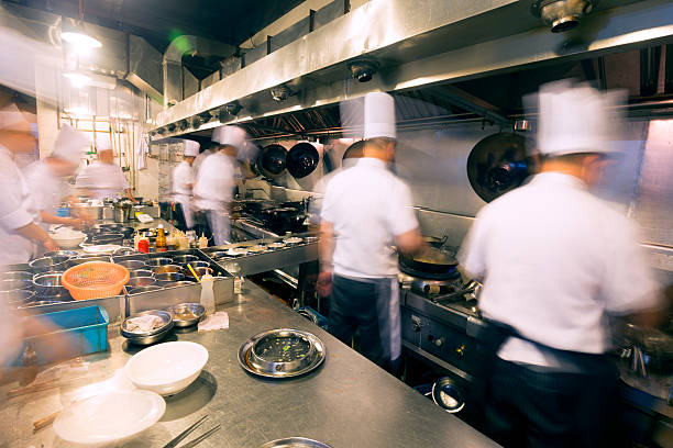 Chinese kitchen busy at work stock photo