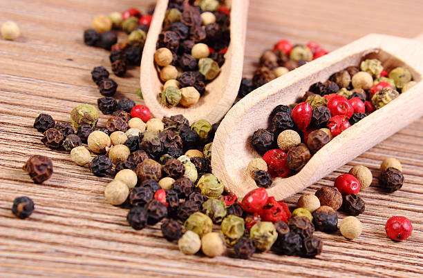 istock Fresh colored pepper with spoon on wooden background 488090074