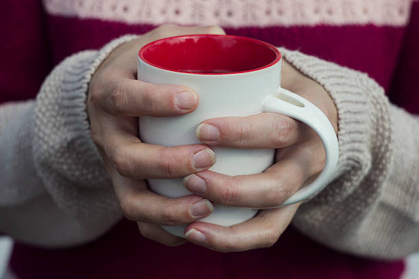 istock Soft and blur conception.Woman holds a hot cup of tea 488090394