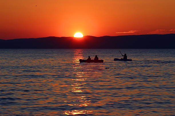 istock Sunset over the lake with boats 488093816