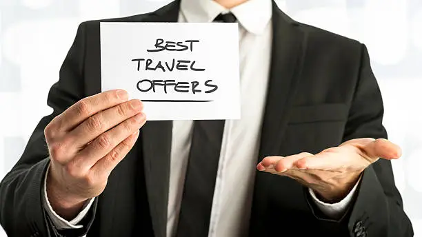 Photo of Businessman with Best Travel Offers Texts on Paper