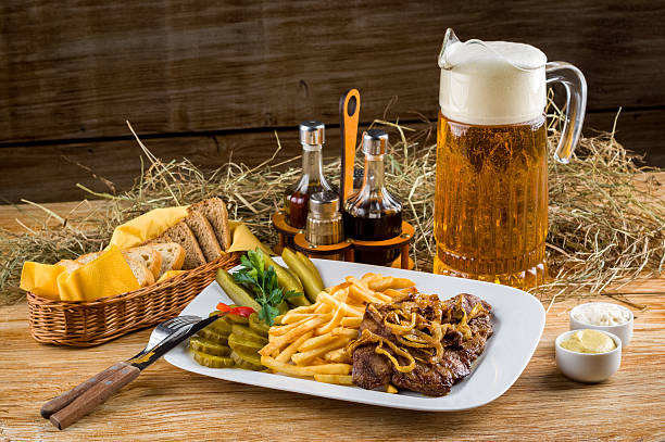 Roast beef, french fries and jug of beer