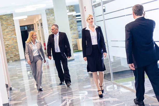 istock Businesspeople Walking in a Modern Interior 488097439