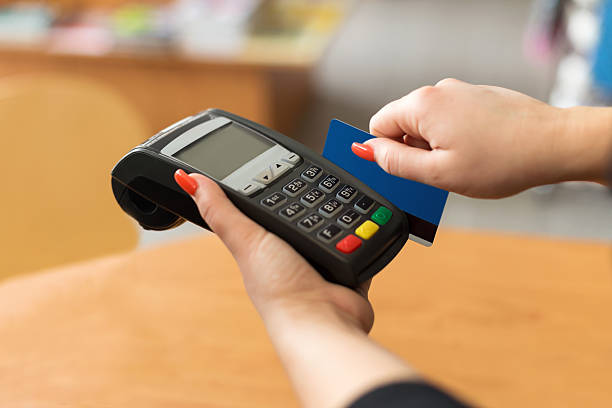 istock Woman pay by credit card 488098013