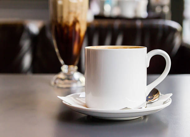 istock Coffee cup and saucer on the table 488098315