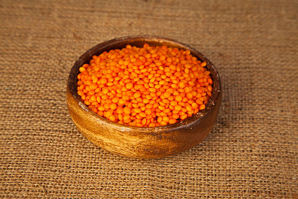 istock Red Lentils in a wooden bowl 488104151