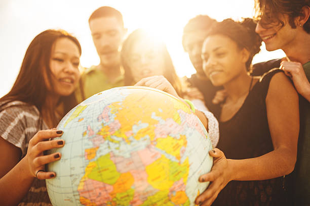 istock teenagers college student smiling with globe 488104405
