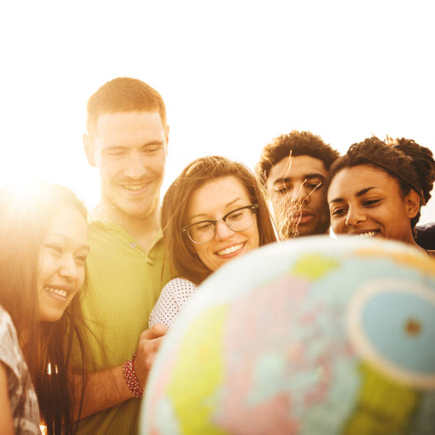 istock teenagers college student smiling with globe 488104407