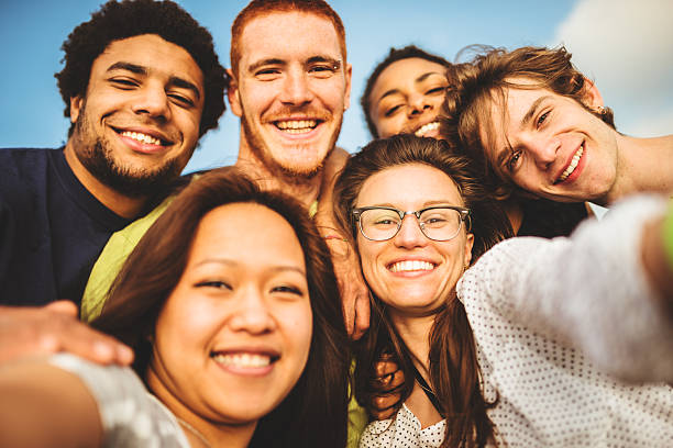 istock Group of friends laughing and doing a selfie 488104419