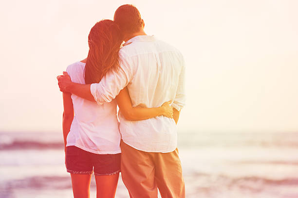 istock Romantic Couple Enjoying Beautiful Sunset at the Beach 488106718
