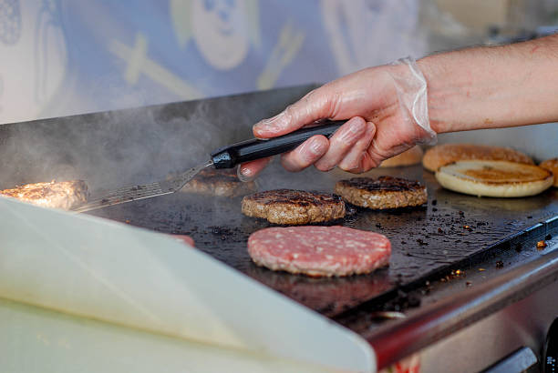 istock Cooking burgers in a fastfood 488106802
