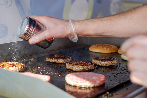 istock Cooking burgers in a fastfood 488106838