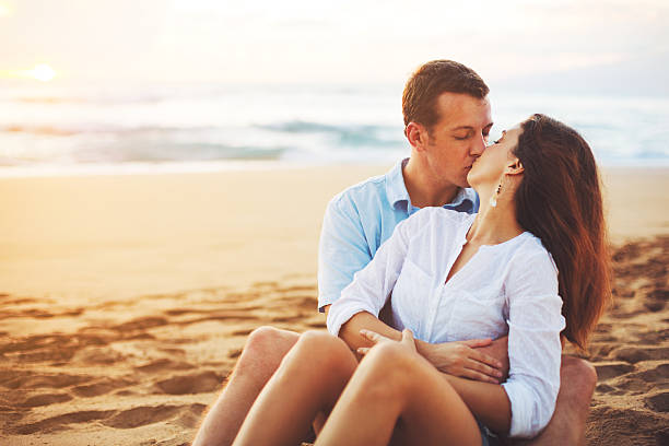 istock Romantic Couple Enjoying Beautiful Sunset at the Beach 488106850