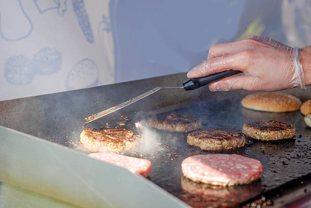 istock Cooking burgers in a fastfood 488106876