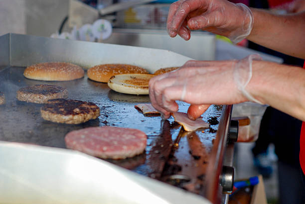 istock Cooking burgers in a fastfood 488106910
