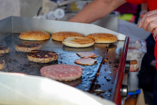 istock Cooking burgers in a fastfood 488106922