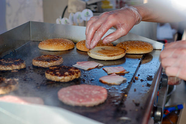 istock Cooking burgers in a fastfood 488106952