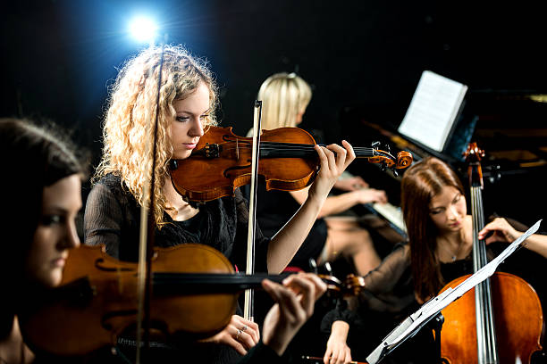istock Serious violinist in female quartet. 488109006