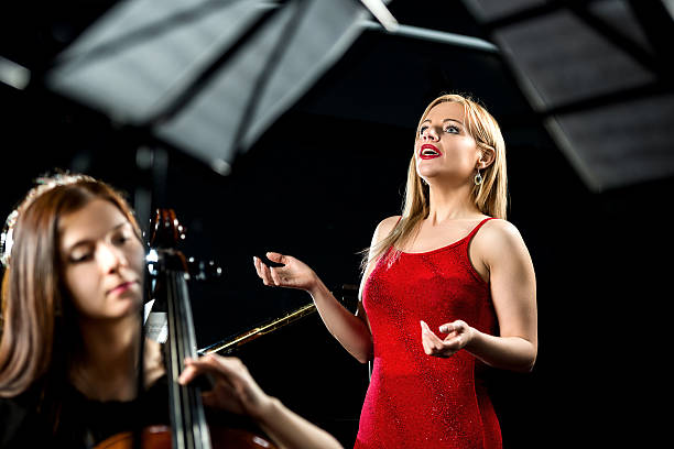 istock Opera singer singing at rehearsal. 488109518