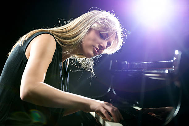 istock Female pianist enjoying while playing piano. 488109646