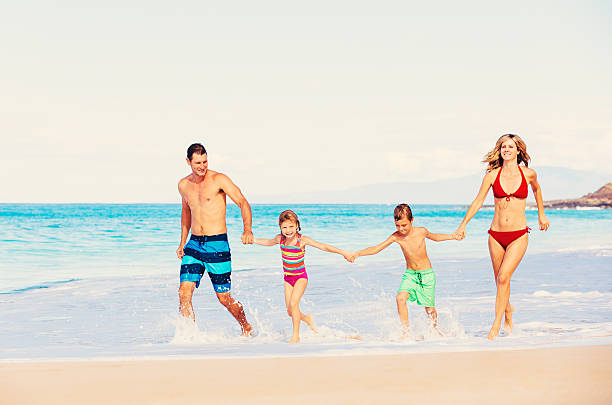 istock Happy Family Having Fun on the Beach 488109672