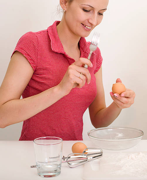istock young woman on kitchen fooling around 488109748