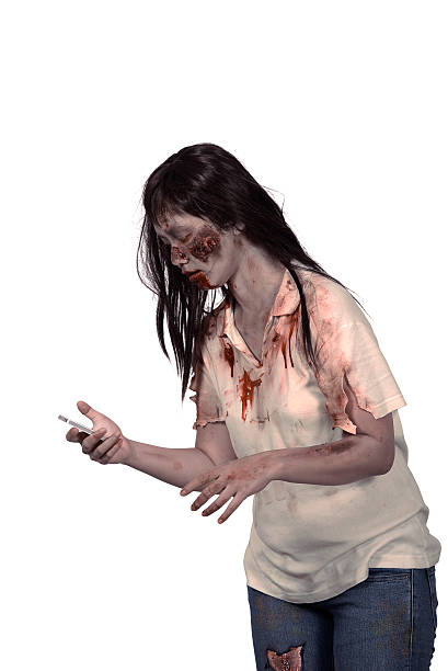 istock Female zombie holding cellphone 488110778