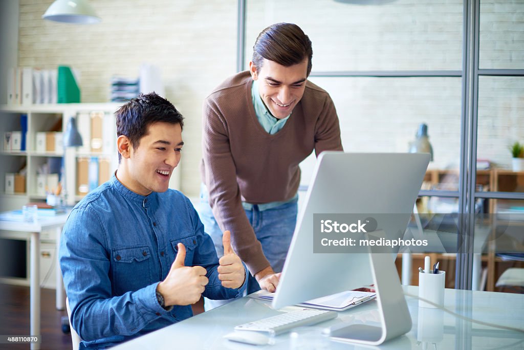 Good job! Young workers have just sold their project successfully 2015 Stock Photo