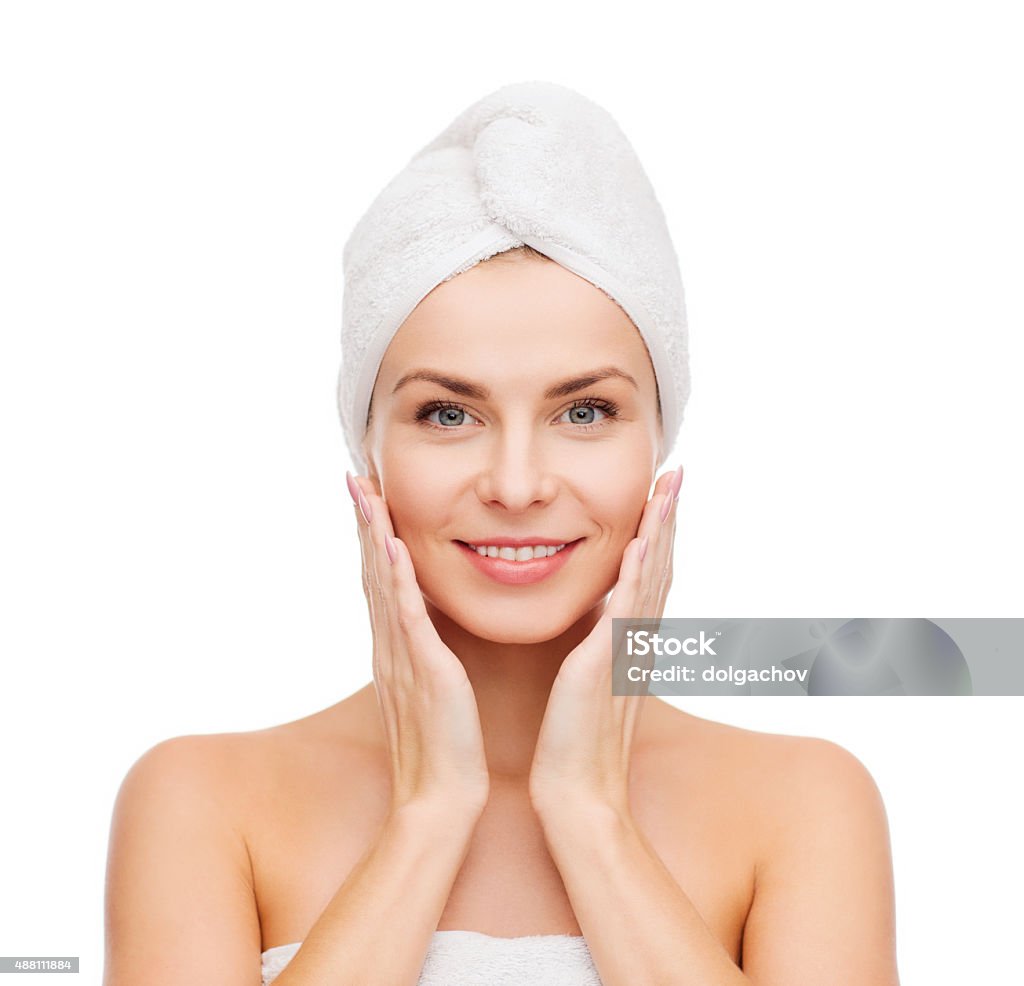 beautiful woman in towel health, spa and beauty concept - beautiful woman in towel One Woman Only Stock Photo