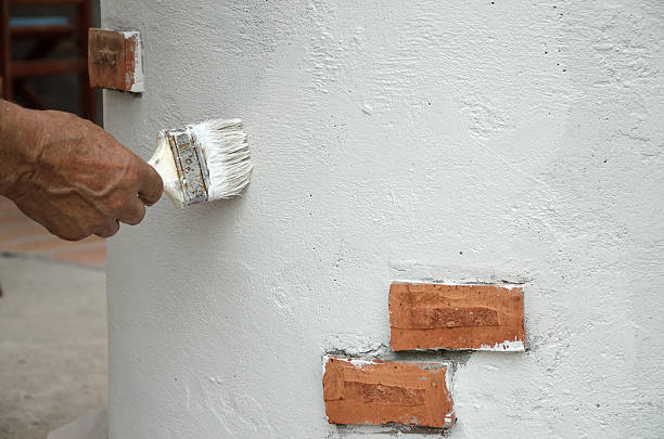 istock Painting brush on white wall 488111988