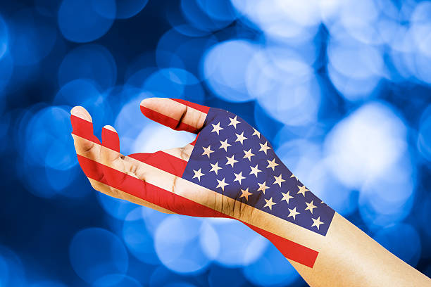 istock American flag in the powers of hand 488112800