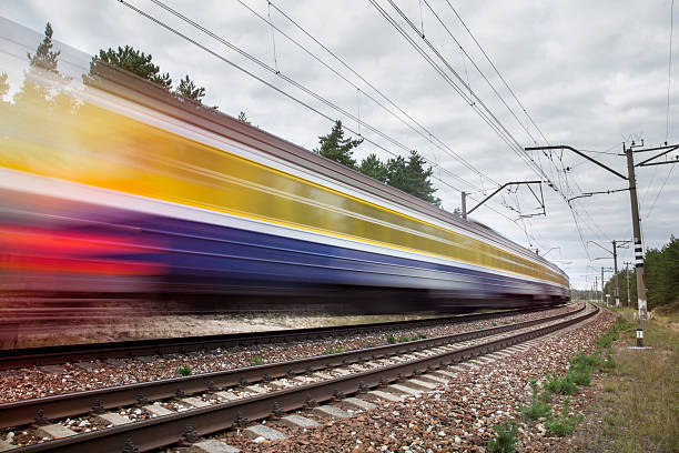 istock passenger train on railroad tracks in speed motion 488114006