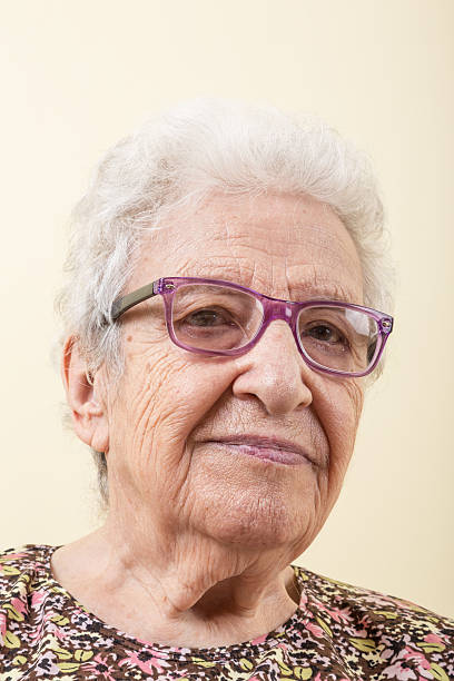 istock senior woman wearing eyeglasses 488114310