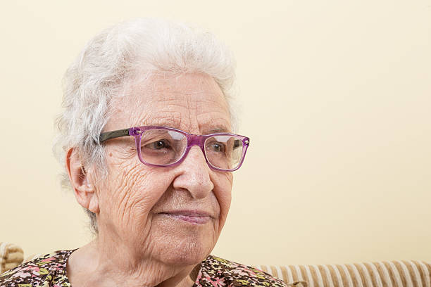istock senior woman wearing eyeglasses 488114418