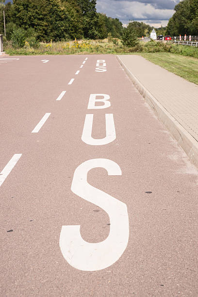 istock bus lane marked on asphalt 488115060