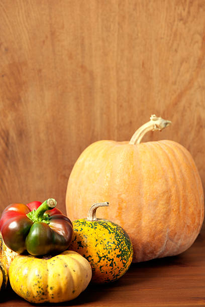 istock Pumpkin on wooden background 488115526