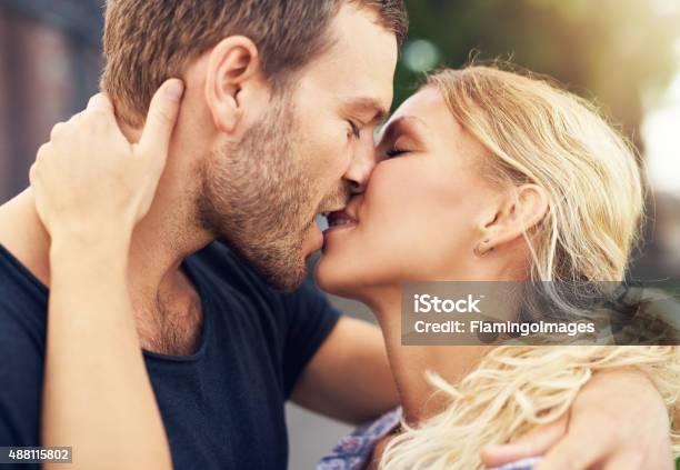 Young Couple Deeply In Love Stock Photo - Download Image Now - Kissing, Young Couple, Women