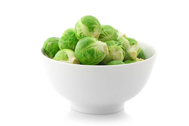 Brussels sprouts in bowl stock photo