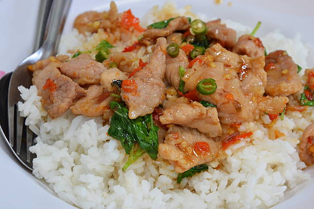 istock spicy stir-fried pork with basil leaf and chili on rice 488118412
