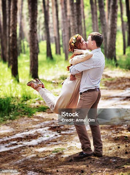 Happy Couple In The Forest Stock Photo - Download Image Now - 2015, Adult, Adults Only