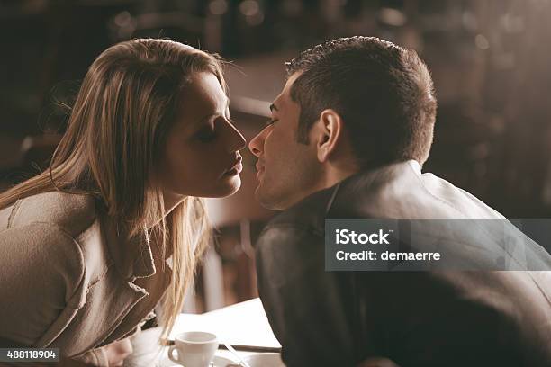 Couple Kissing Stock Photo - Download Image Now - Coffee - Drink, Couple - Relationship, Kissing